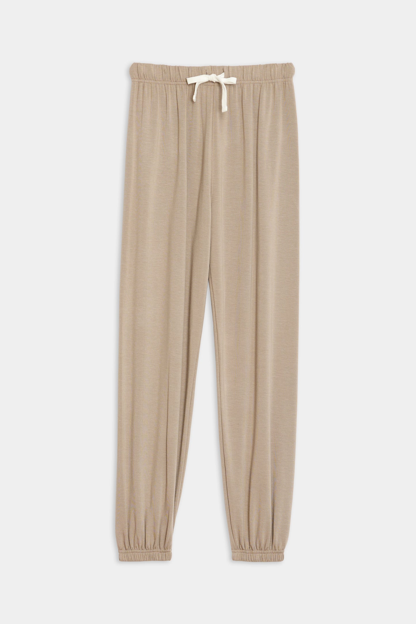 Beige drawstring jogger pants with elastic waistband and cuffs, crafted from a soft blend of modal and spandex fabric, displayed on a white background can be replaced with Andie Oversized Fleece Sweatpant - Latte by SPLITS59.