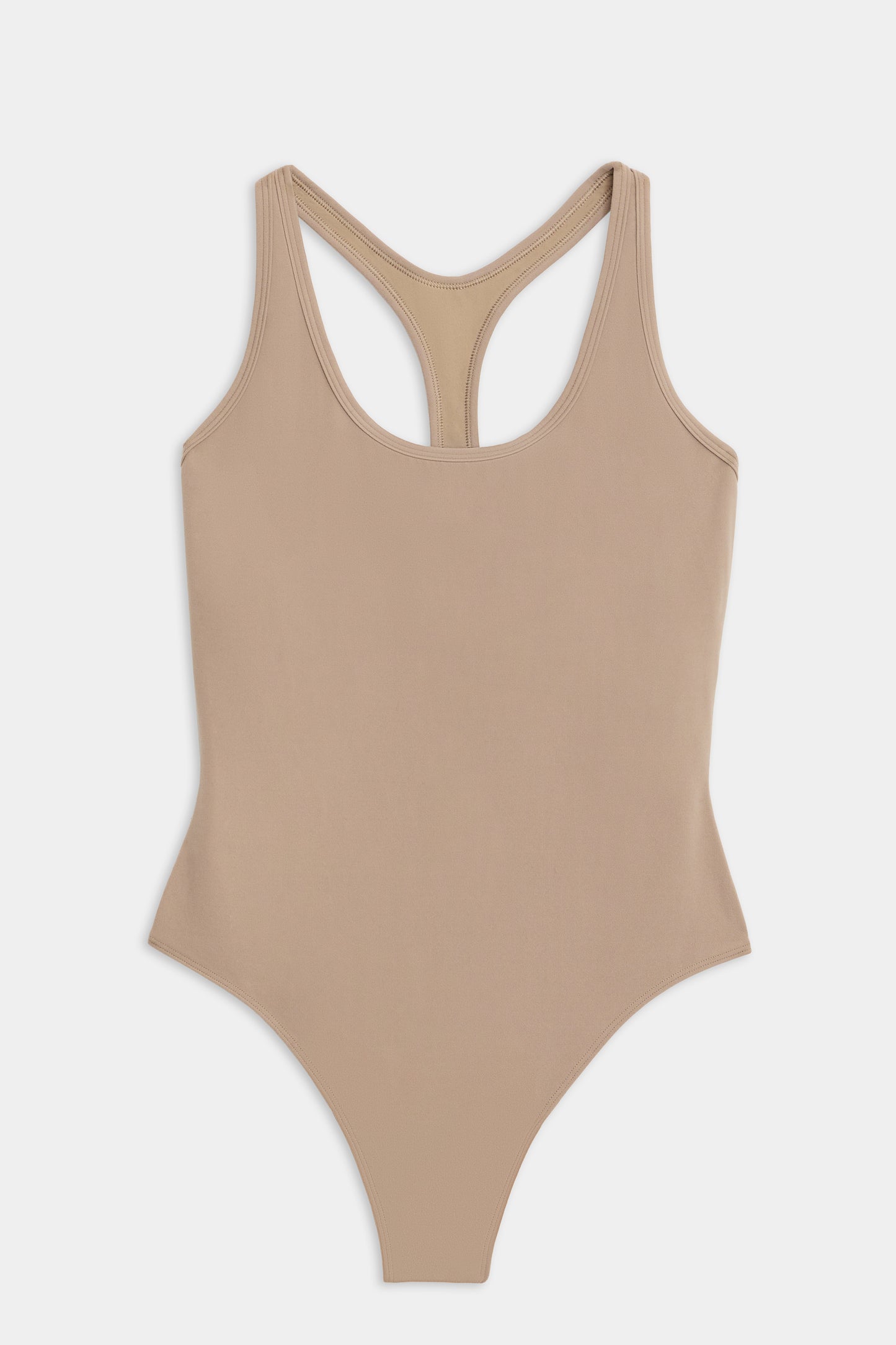 The SPLITS59 Suki Airweight Bodysuit in latte, perfect for hot yoga, is sleeveless with a stylish racerback and is displayed flat on a white background.