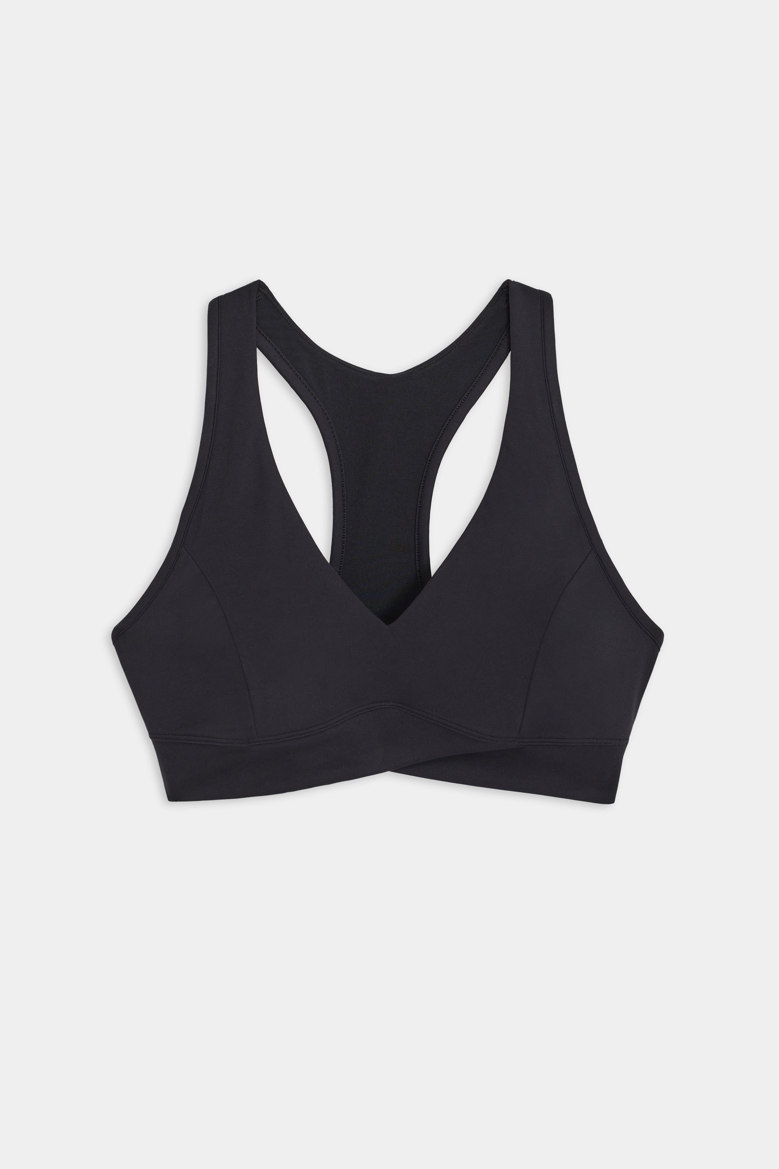 The black Mia Rigor Bra by SPLITS59, made from ultra luxe Rigor fabric with a racerback design, showcases functionality and style for multi-sport performance on a plain white background.