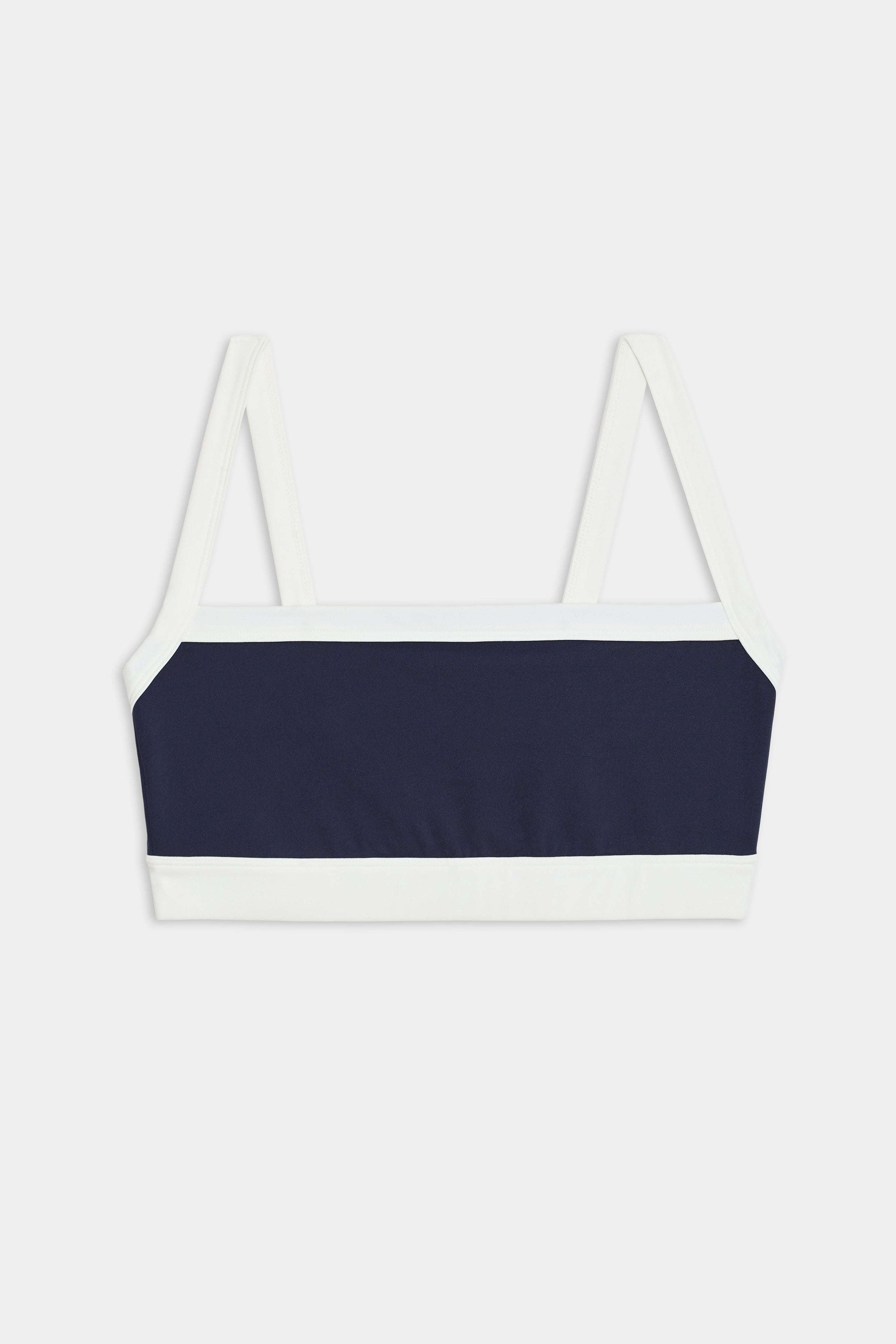 The SPLITS59 Monah Rigor Bra in Indigo/White features thin shoulder straps, ideal for gym workouts. Displayed on a white background, it highlights its sleek design perfect for any exercise routine.