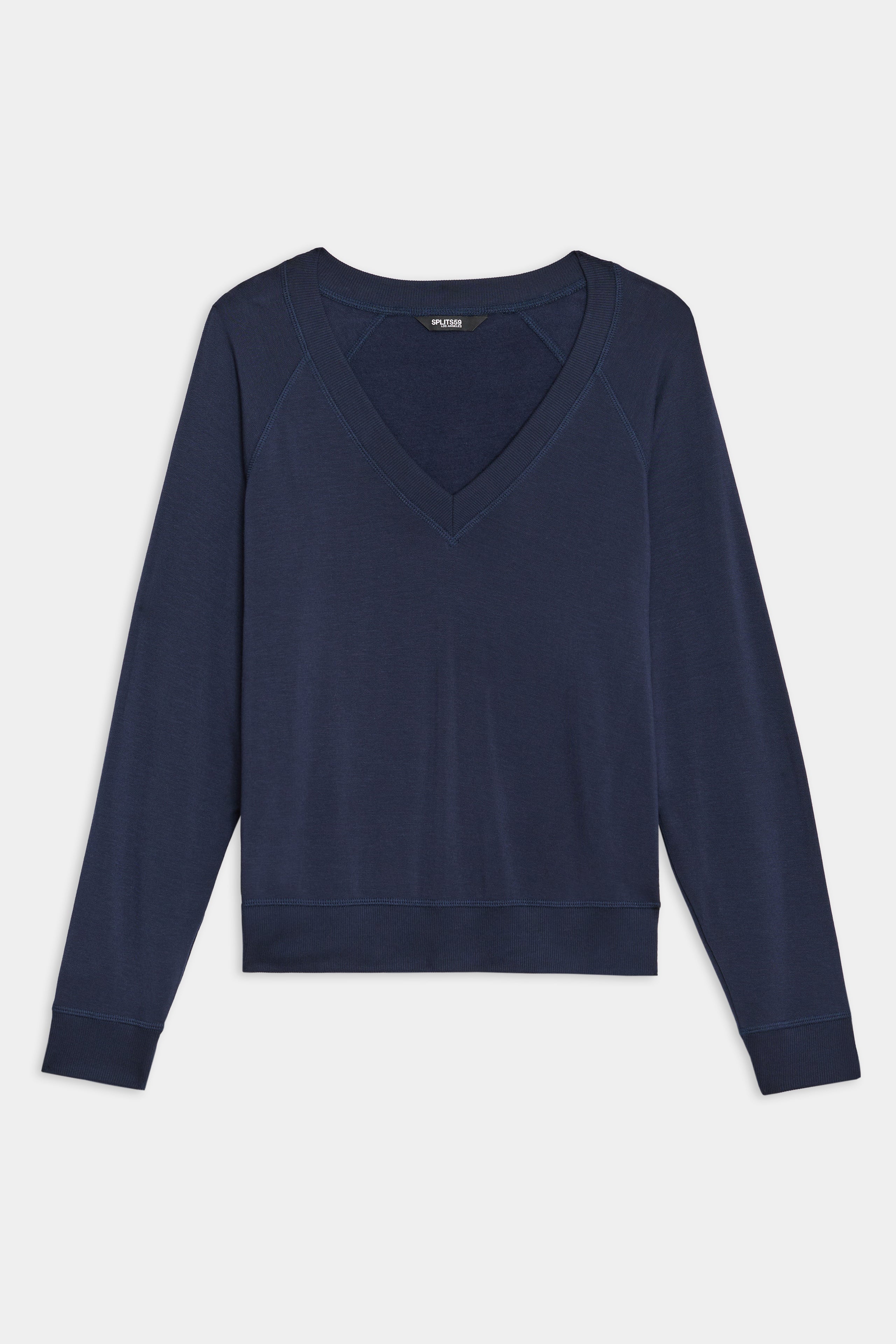 The SPLITS59 Bennie Fleece V-Neck Sweatshirt in indigo, featuring long sleeves and crafted in Los Angeles, is elegantly set against a white background.