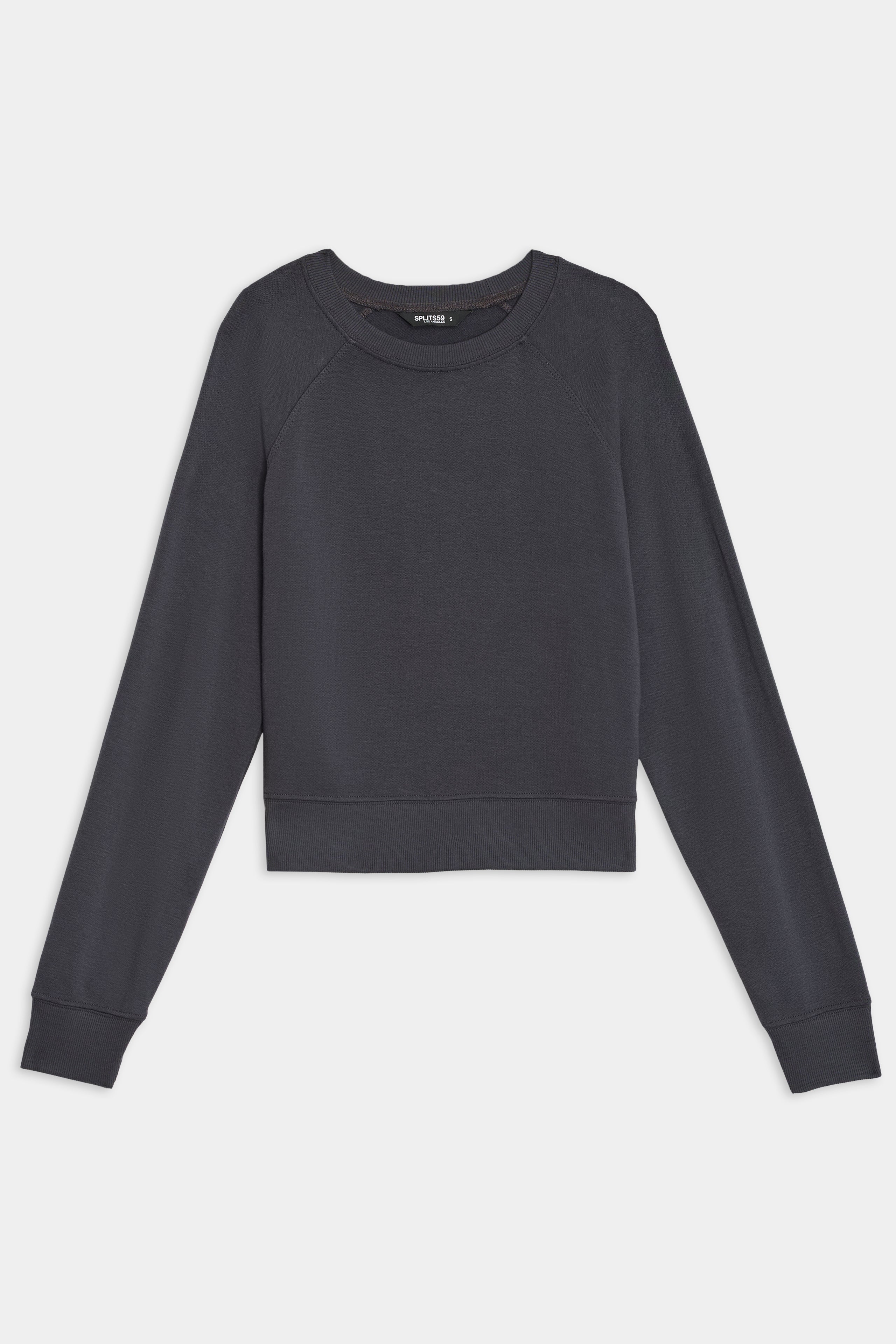 SPLITS59's Brooks Fleece Long Sleeve Sweatshirt, in dark gray, features a crew neckline and ribbed cuffs, laid flat on a white background.