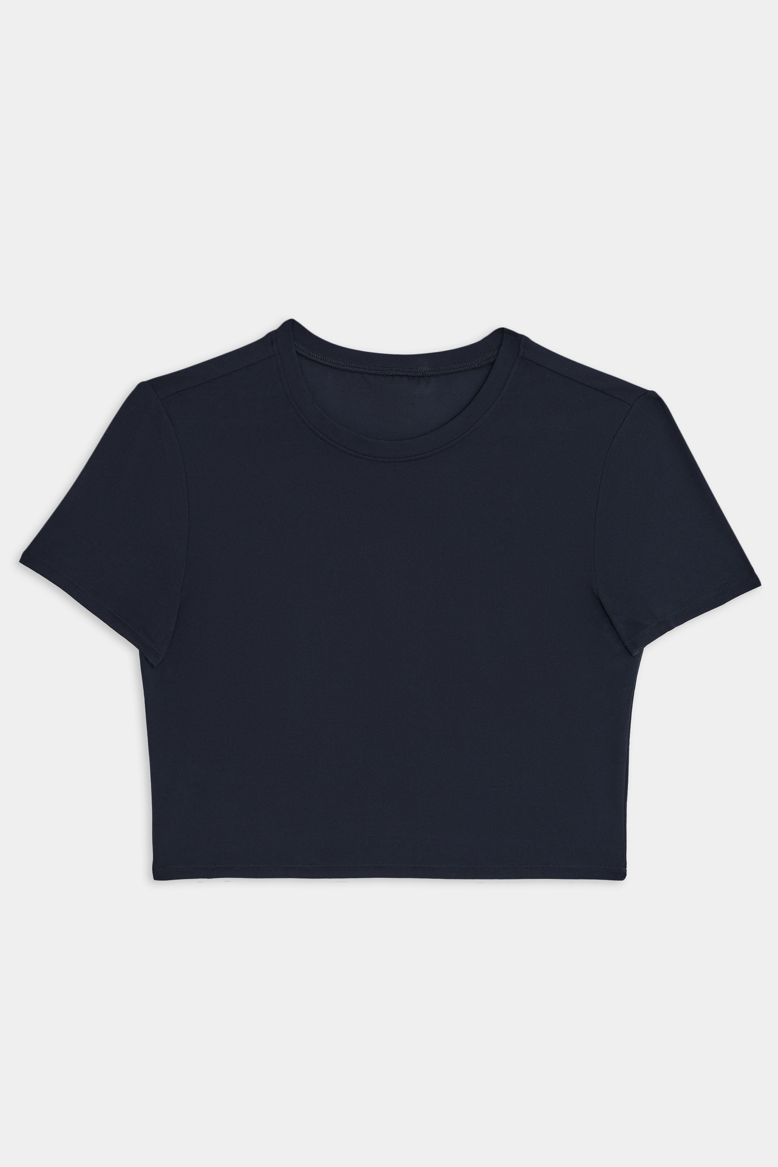 Plain navy blue Airweight S/S Crop - Black made from nylon spandex fabric on a white background by SPLITS59.