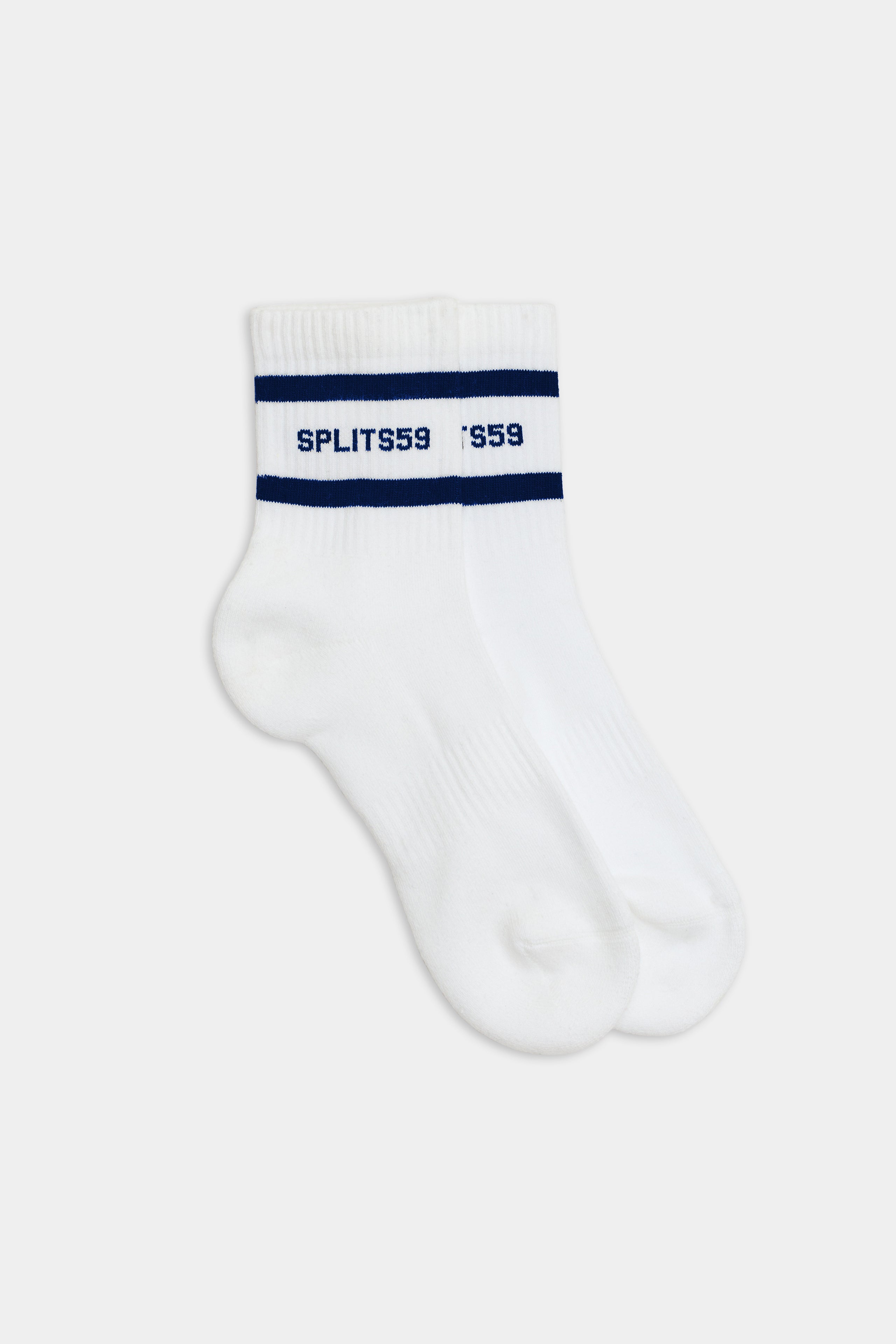 A pair of white ankle socks with blue stripes and the text "SPLITS59" displayed above the stripes, reminiscent of vintage sport style—Logo Stripe Quarter Socks - White/Indigo by SPLITS59.