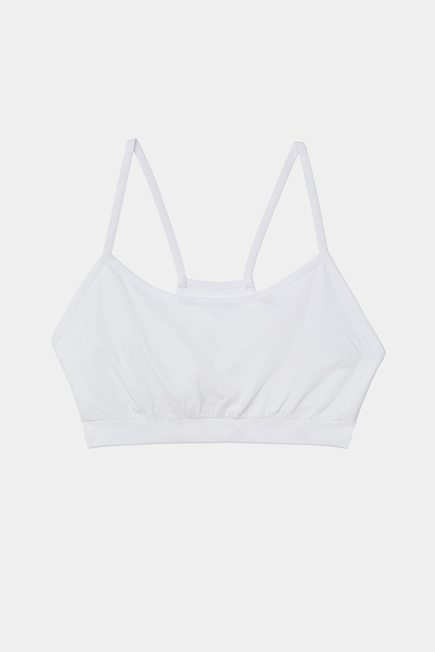 A Loren Seamless Bra - White on a white background.