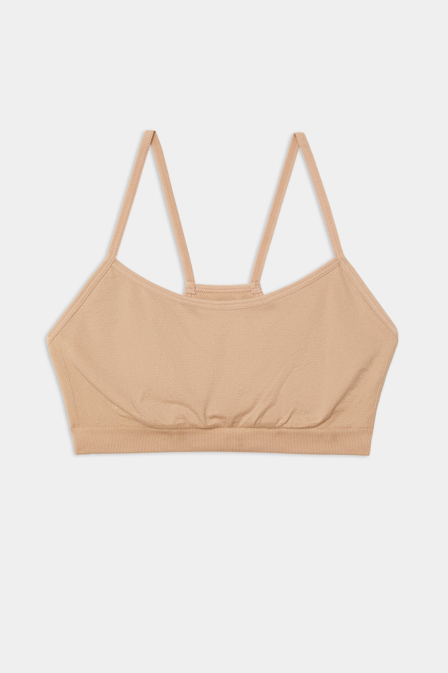 A Loren Seamless Bra in Nude on a white background from Splits59.